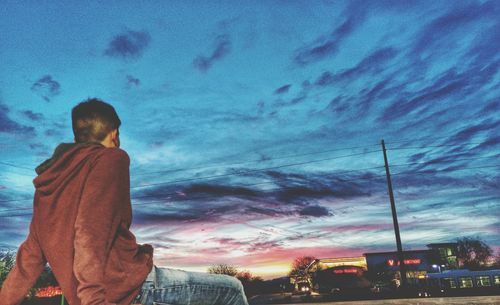 Man against multi colored sky