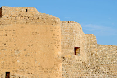 Low angle view of old building against sky