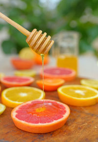 Close-up of grapefruit slices on table