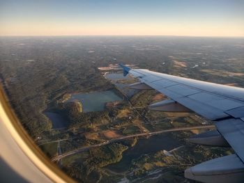 Aerial view of cityscape seen through airplane window