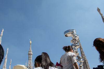 Low angle view of eiffel tower against blue sky