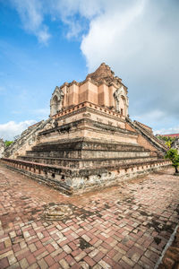 Old temple building against sky
