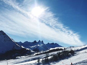 Scenic view of snowcapped mountains against sky