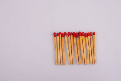 Close-up of colored pencils against white background