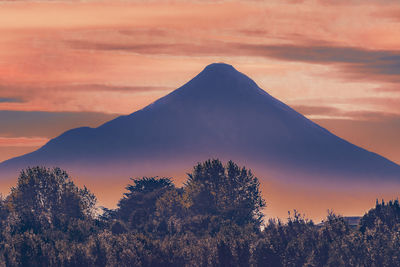 Scenic view of mountains against sky during sunset