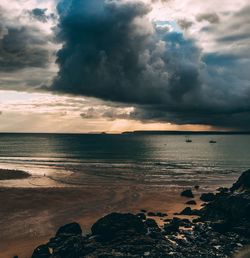 Scenic view of sea against cloudy sky