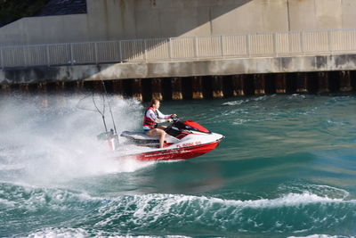 People in boat on sea