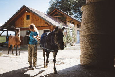 Rear view of man riding horse