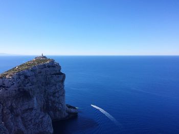 Scenic view of sea against clear blue sky