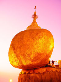 View of temple against clear sky during sunset