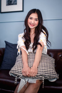 Portrait of smiling young woman