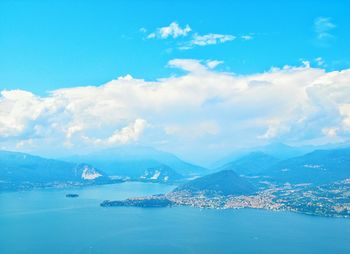 Aerial view of lake and mountains against sky