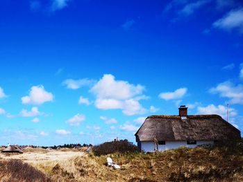 House on field against sky