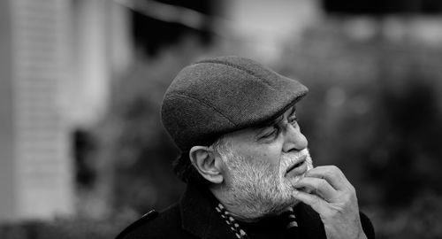 Portrait of man looking away outdoors