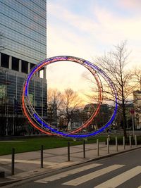 Ferris wheel in city against sky