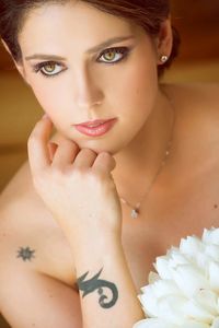 High angle view of thoughtful bride with white flowers