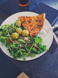 High angle view of vegetables in plate on table