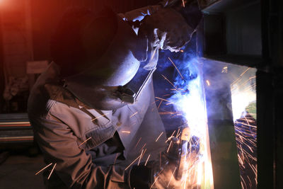 Close-up of person welding at workshop