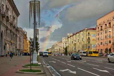 View of city street and buildings against sky