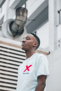 Low angle view of young man looking away