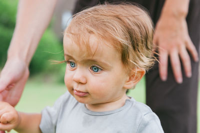 Close-up of cute baby boy against mother