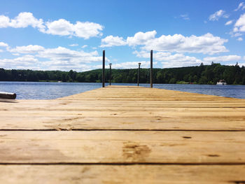 Pier over lake against sky