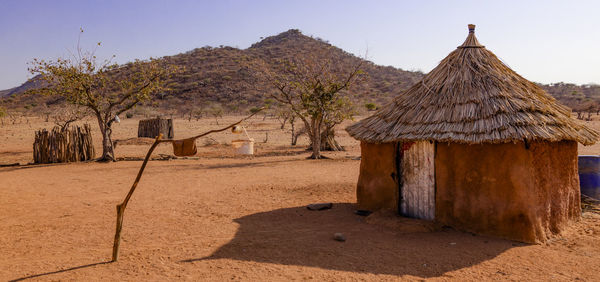 A himba hut in a small village near opuwo, a town in the kunene region of namibia