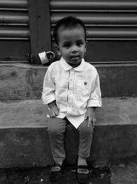 Portrait of cute boy standing outdoors