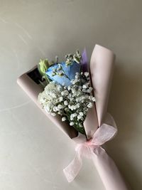 High angle view of small flower on table