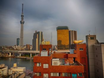 River by tokyo sky tree against sky