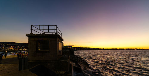 Scenic view of sea against clear sky during sunset