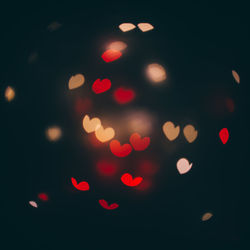 Defocused image of illuminated lights at night