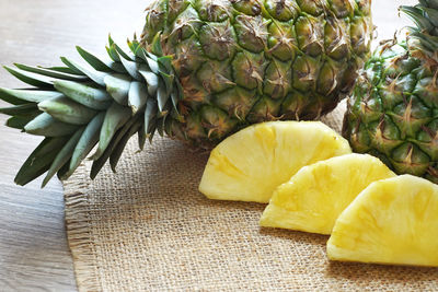 Close-up of fruits and leaves on table