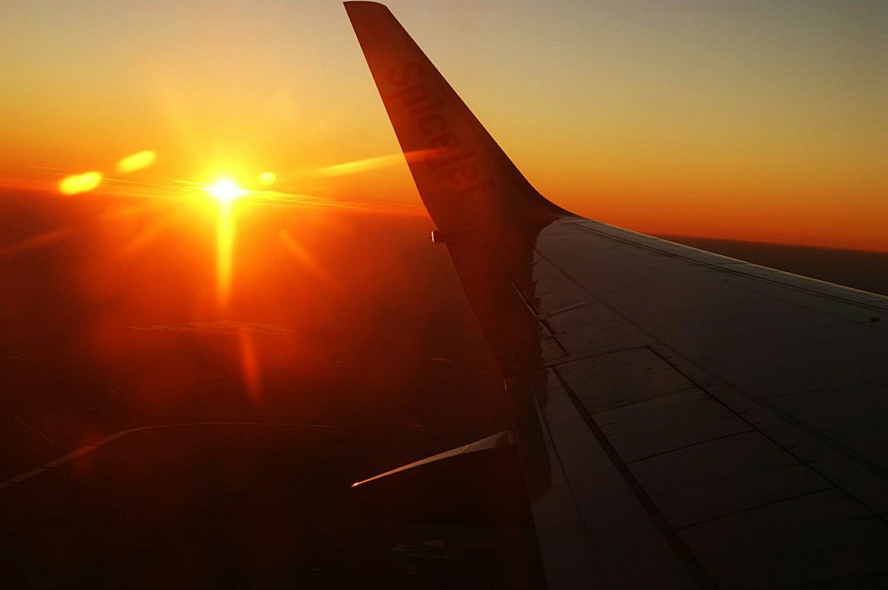 sunset, sun, orange color, sunlight, sunbeam, lens flare, silhouette, sky, clear sky, no people, nature, beauty in nature, part of, bright, airplane, outdoors, scenics, transportation, aircraft wing, tranquility