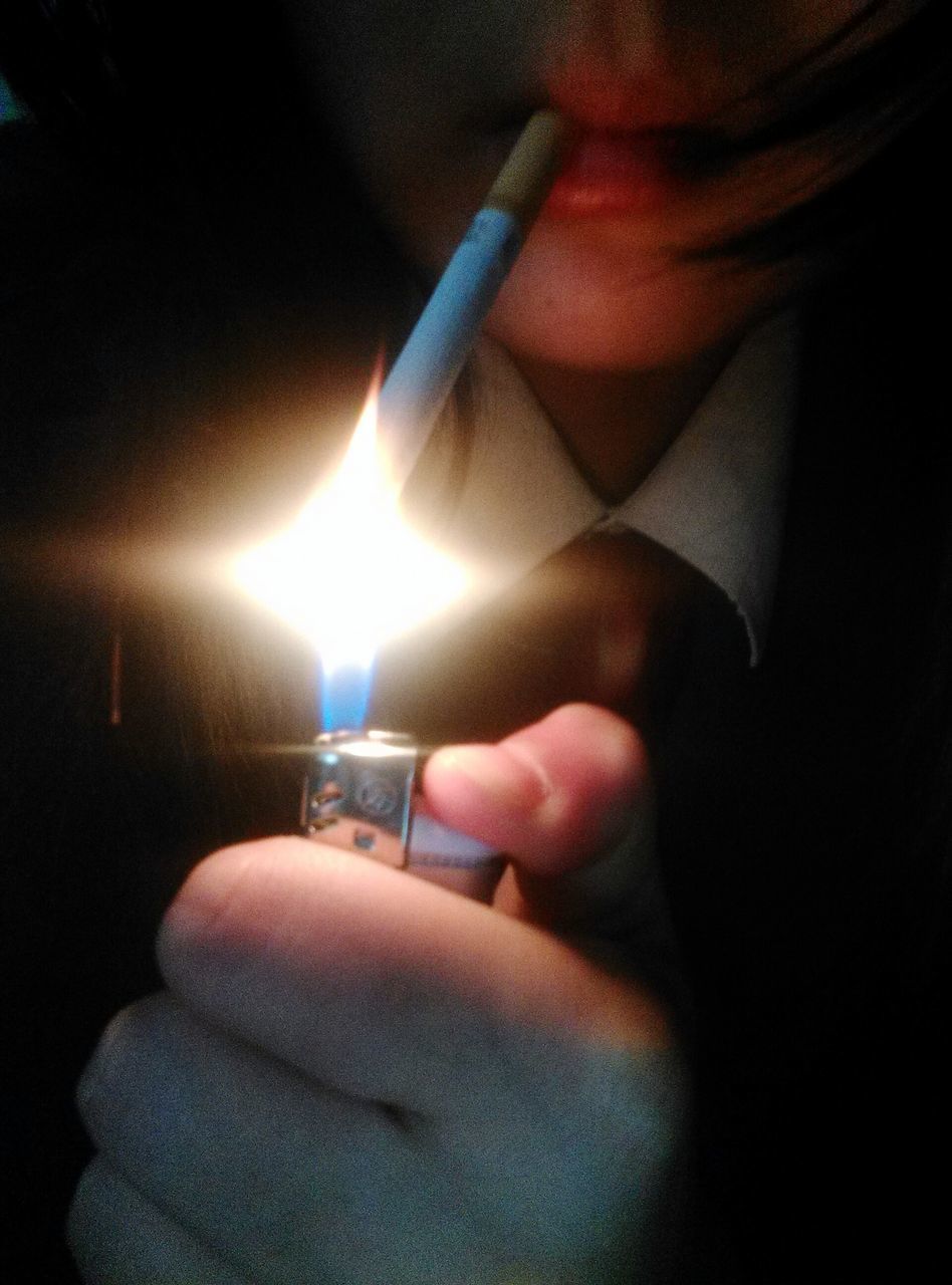 person, indoors, holding, part of, human finger, burning, illuminated, close-up, cropped, flame, candle, heat - temperature, fire - natural phenomenon, glowing, lifestyles, night, unrecognizable person