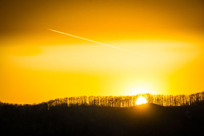 Scenic view of silhouette landscape against sky during sunset