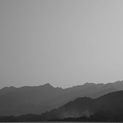 Scenic view of silhouette mountains against sky