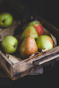 Close-up of apples on wood