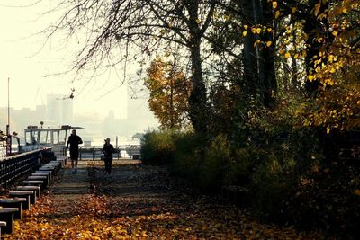 Woman walking on footpath
