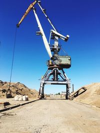 Construction site against clear blue sky