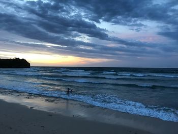 Scenic view of sea against dramatic sky