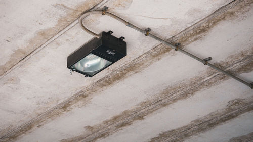 Low angle view of telephone on wall