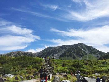 Scenic view of mountains against cloudy sky