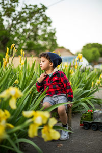 Full length of cute boy against plants