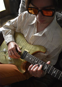 Portrait of man playing electric guitar