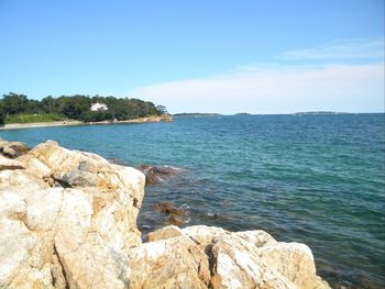 Scenic view of sea against clear blue sky