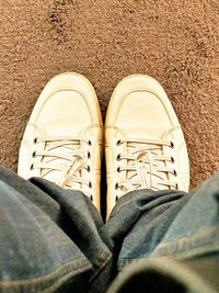 Low section of woman standing on tiled floor