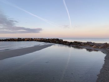 Scenic view of sea against sky during sunset