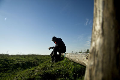 Man riding bicycle on field