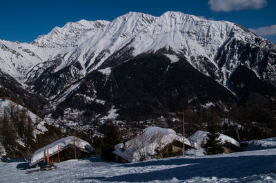 Scenic view of snowcapped mountains against sky